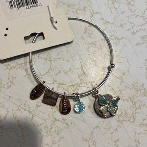 Expandable wire bracelet w/a blue glitter butterfly &other charms